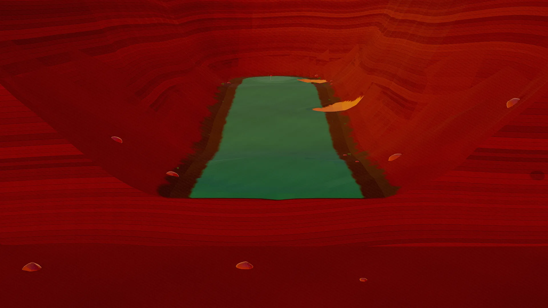 Aerial view from behind the tee of a Canyons par 4, red-rock walls layered around the fairway